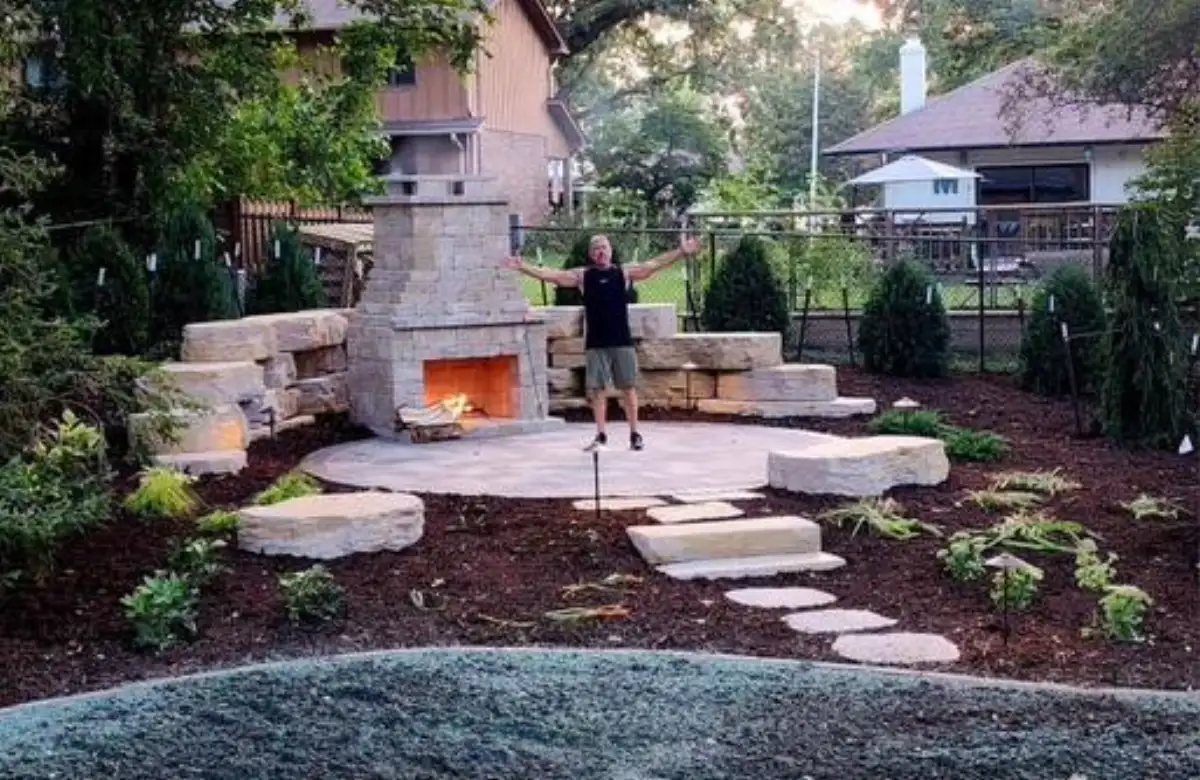Outdoor fireplace with pergola and comfortable patio seating